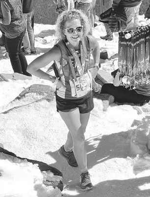 Campus Colts assistant cross country coach Amy Driskill stands in the snow at the top of Pikes Peak in Colorado. Last month, she ran in the Pikes Peak Marathon, placing second in her age grouop. Contributed photo