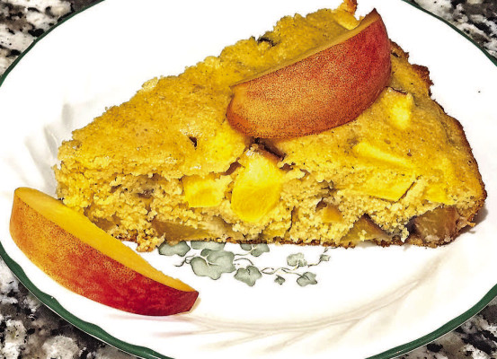 Peach cornbread is a new take on classic cornbread, featuring juicy pops of fruit throughout the sweet corn cake. It would be great served drizzled with honey or just with a big scoop of vanilla ice cream.