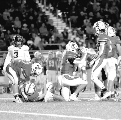Cheney Cardinals help each other up after a play during Friday’s victory over the Holcomb Longhorns. Cheney will host Clay Center this week. Andrea McDaniel/Contributed photo
