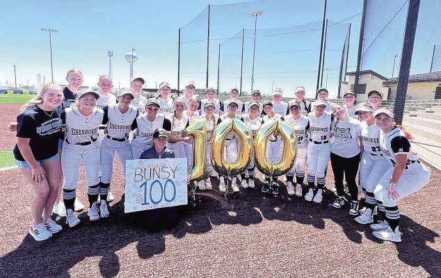 Amber Brunswig and the 2024 Eisenhower High School softball team celebrate her 100th victory as the Tigers’ head coach in May 2024. Contributed photo