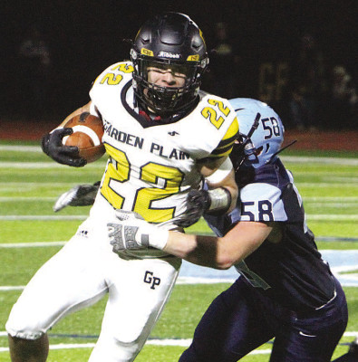 Garden Plain runner Pete McGregor is tackled by Clearwater defender Brogan Ede during Friday’s nonleague game. Additional photos will be posted online at www.tsnews.com. Travis Mounts/TSnews
