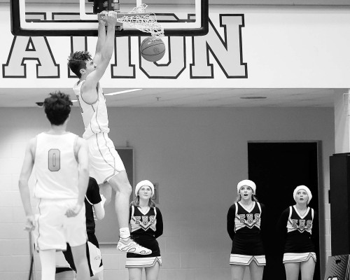 Pierce Blue throws down a dunk during Eisenhower’s home win against the Campus Colts. The Tigers got out to a big lead and then survived the Colts’ comeback effort. Matt Bucher/Ginger Viking Fotos