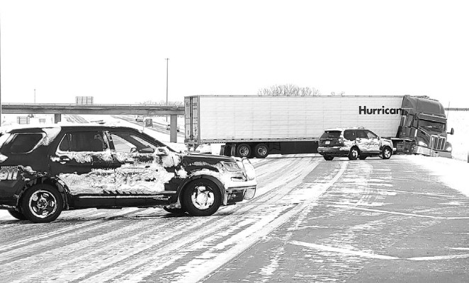 A semi that had jackknifed on US-54 near the Cheney exit had traffic blocked Tuesday morning. Paul Rhodes/TSnews