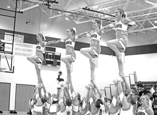 The Clearwater Indians cheerleaders perform a stunt during last Friday's home basketball game. The girls won in a blowout, while the boys lost a close game to Arkansas City. See more in Sports, Page B1. Stephanie McKennon/ TSnews