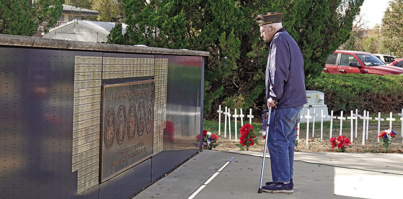 A veteran reads the names of deceased veterans at the Veterans Memorial in Haysville following last week’s Veterans Day program. The memorial is located just north of the Haysville Community Library. City of Haysville/Contributed photo