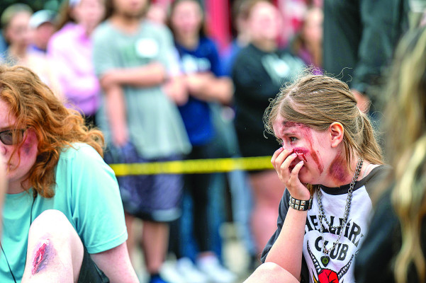 Students portray injured students at last week's mock DUI crash at Eisenhower High School. Goddard Public Schools held mock crashes at EHS and at Goddard High. The events showed the real-world consequences of driving while intoxicated. USD 265/Contributed photo