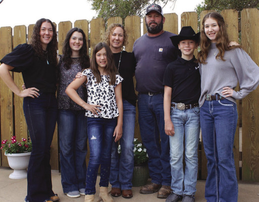 Byron and Heidi Wells and their children were named as the Farm Family of the Year at the recent Sedgwick County Farm Bureau annual meeting. They operate a dairy farm just outside of Cheney. Contributed photop