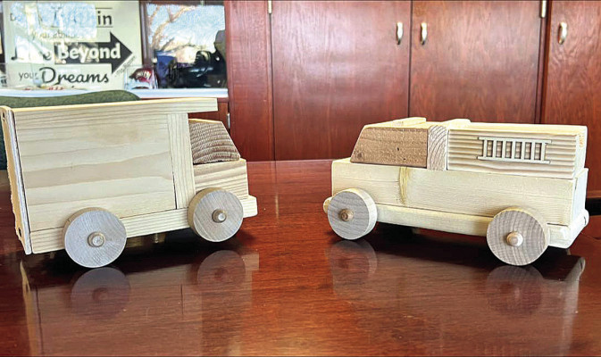 Each year, Campus High School industrial arts students create 500 wooden toys to donate to Toys For Tots. This year’s toy is a fire truck, pictured at right. Previous toys have included airplanes, tanks, and trucks like the one pictured at left.