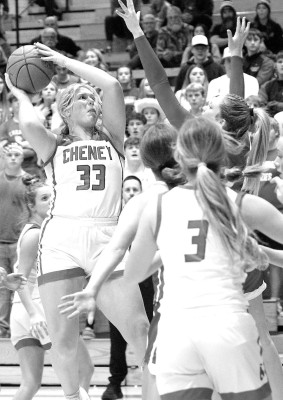 Erika Block shoots from a crowded lane during the second half of Cheney’s game against Wellington. The visiting Crusaders, ranked No. 1 in Class 4A, handed the Cardinals their first loss of the season. Travis Mounts/TSnews