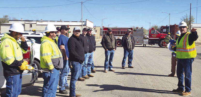 Emergency personnel prepare to enter Argonia City Hall in search of a staged natural gas leak. The city hosted the safety training event last Thursday. It was coordinated by the Kansas Corporation Commission. Tara Pearce/Contributed photo