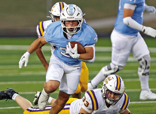 Brayden Pappas left behind many tacklers during Friday’s Eisenhower win. He ran for 382 yards and scored five touchdowns on homeocming night. Matt Bucher/ Ginger Viking Fotos