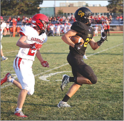 Pete McGregor of Garden Plain breaks away from Conway Springs’ defender Grant Fisher for a big first-half gain. Conway Springs scored first, but Garden Plain answered with two touchdowns before halftime en route to a 20-14 victory. It was the Owls’ fifth straight win over the Cardinals. Stephanie McKennon/TSnews