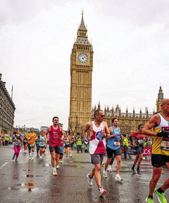 Darren Martin, seen in a City of Wichita flag shirt, runs in the London Marathon. The former Garden Plain resident has run in all six of the world’s major marathons – Boston, New York, Chicago, Tokyo, London and Berlin. Contributed photo