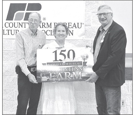 Philip and Donna Wise receive their Sesquicentennial Farm Award. The farm near Clearwater was originally homsteaded by Marie Wiley-Wise, Philip’s great-great-grandmother. Dale Stelz/TSnews