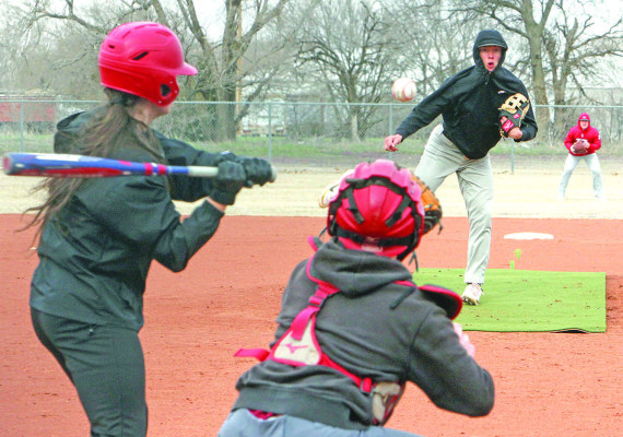 Members of the Conway Springs-Argonia Reds baseball team practice on Monday, despite cold and windy conditions. The Reds will open the baseball season at home this Thursday with a doubleheader against the Marion Indians. This is the first year for baseball and softball for Conway Springs and Argonia high schools. Travis Mounts/TSnews