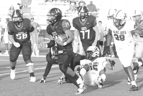 Jaxon Denard finds a hole in the Junction City defense during the Campus Colts’ home opener last Friday. It was a rough evening for the Colts, who lost 55-0 to the visiting Blue Jays. Travis Mounts/TSnews