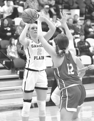 Reese Stuhlsatz shoots over a Wellington defender during Garden Plain’s home opener last Thursday. Stuhlsatz is the Owls’ top scorer through two games. John Bloomquist/Contributed photo