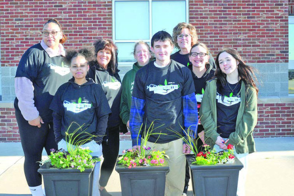 Dale Stelz/TSnews The annual Neighbors United event was held Saturday in Goddard. Volunteers came together to work on different projects, including the Goddard Virtual Academy students who helped with plants at Goddard Academy. Students at Goddard Academy organized this year's event.