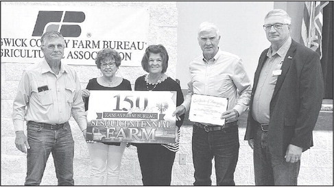 Members of the Armour family show off their Sesquicentennial Award at the Sedgwick County Farm Bureau banquet. Their farm is located north of Clonmel. Dale Stelz/TSnews