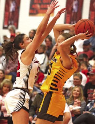 Delaney Jones, left, defends a Belle Plaine ball handler during last Friday’s homecoming game. Stephanie McKennon/TSnews
