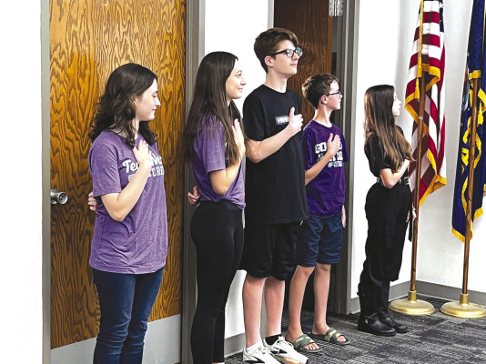 Students from Haysville West Middle School represented their school earlier this month by leading the USD 261 Board of Education in the Pledge of Allegience. Contributed photo