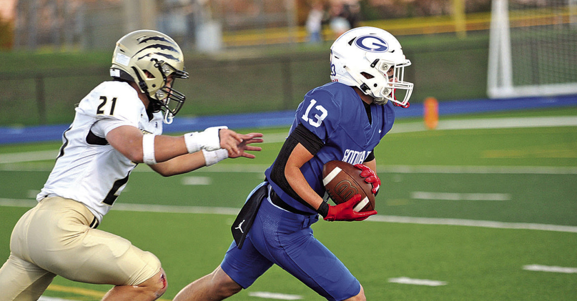 Bentley Bliss of Goddard runs out of the reach of an Andover Central defender during the first half of Friday’s homecoming game. The Jaguars played the role of spoiler, beating the Lions. Dale Stelz/TSnews