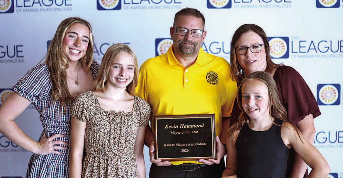 Mayor Kevin Hammond of Garden Plain is joined by his family after being named as the Kansas Mayor of the Year by the Kansas Mayors Association. Hammond was surprised with the award during last week’s League of Kansas Municipalities meeting in Wichita. John Bloomquist/Contribted photo