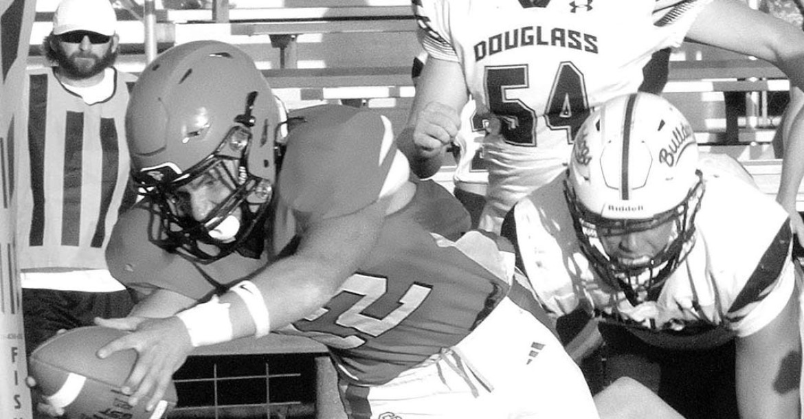 Gabriel Tarrant dives forward for extra yards during Conway Springs’ game against Douglass. Travis Mounts/TSnews