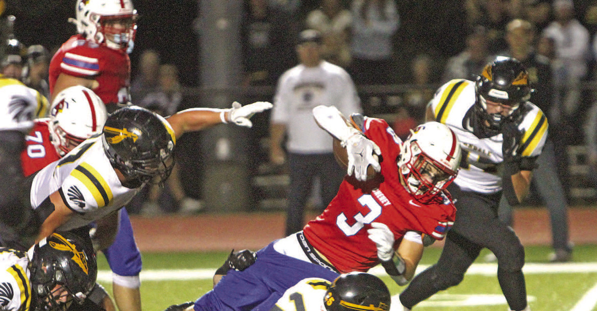 Cheney's Sam Johnson leans forward for extra yards during the Cardinals' battle with No. 1 Andale. Travis Mounts/TSnews